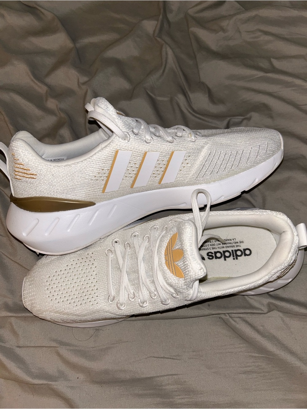 adidas White Knit Sneakers with Gold Accent Stripes
